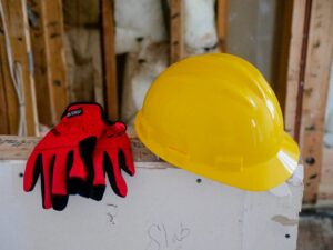 hard hat and gloves of Houston commercial general contractor