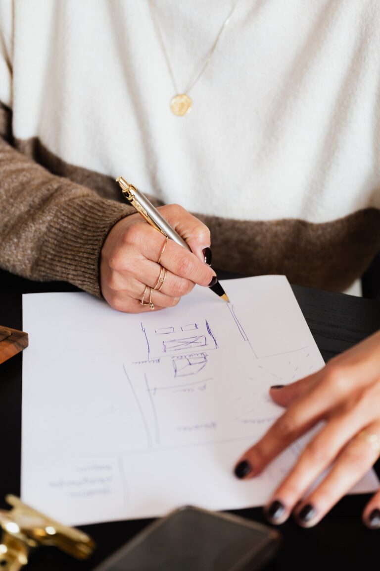 woman sketching retail floor plan for Houston general construction