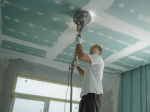 Man sanding for Houston commercial build out