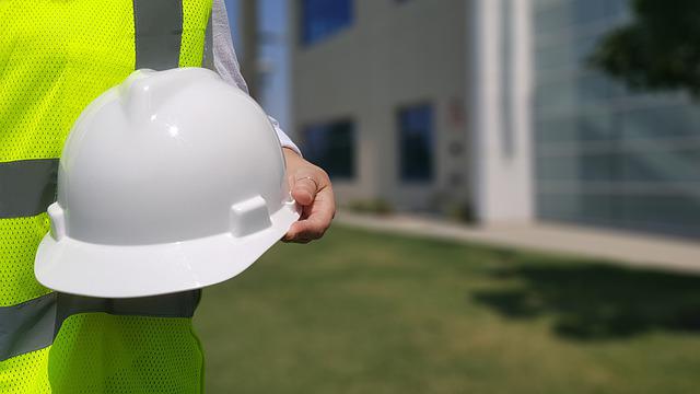 Houston commercial general contractor holding hard hat