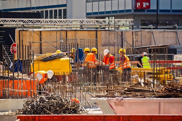 Construction professionals in the middle of Houston pre-engineered steel construction